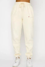 Cream-colored cotton joggers with drawstring waistband in Round Neck Sweatshirt and Joggers Set