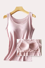 A soft pink round neck tank with built-in bra and smooth fabric designed for comfort and support