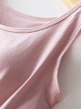 A soft pink round neck tank sleeveless top with smooth lightweight fabric and neatly stitched edges with bra support