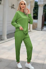 Green round neck top and drawstring pants lounge set with long sleeve length in soft fabric for comfortable wear