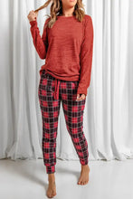 Round neck top and drawstring red and black plaid pajama pants lounge set featuring adjustable waist and comfortable sleeve length