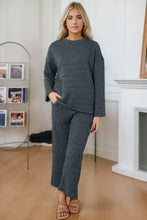 Dark gray quilted two-piece loungewear set with textured geometric pattern featuring long sleeve length round neck top and pocketed pants