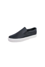Dark blue round toe flat slip-on sneakers with white soles