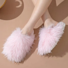 Pair of fluffy pink round toe flats slippers