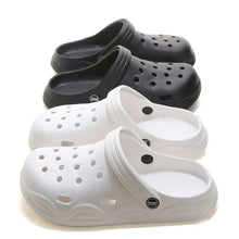 Four pairs of black and white round toe platform slippers