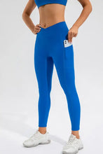 Blue high waist active leggings with V-shaped waistband and side pocket