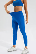 Bright blue high waist active leggings with stretchy waistband and pockets