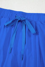 Royal blue shorts with drawstring elastic waistband and tie closure