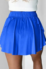 Royal blue pleated tennis skirt with elastic waistband and pockets