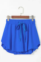 Royal blue high-low hem shorts with elastic waistband and drawstring