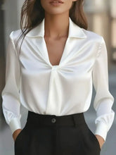 White satin ruched collared neck long sleeve blouse with distinctive twisted front knot and classic collar