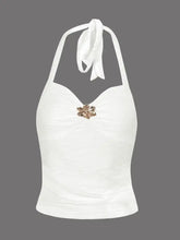 White ruched halter neck cami with a gold-toned floral brooch at the center featuring a halter neck design