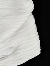 White pleated fabric with soft flowing folds on ruched halter neck cami showcasing elegant ruched halter detailing