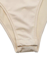 Cream-colored seamless fabric bikini bottom with fine stitching shown alongside ruched spaghetti strap bodysuit detail