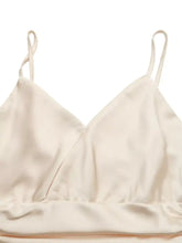 Cream-colored satin ruched spaghetti strap bodysuit with thin adjustable straps and draped neckline