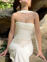 Off-white strapless corset ruched tube top with draped fabric detail paired with matching high-waisted trousers