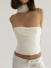A sleek white strapless corset ruched tube top with a fitted design and matching high neck scarf for stylish wear