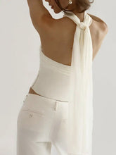 White ruched tube top strapless corset with structured bodice and flowing chiffon tie-back detail