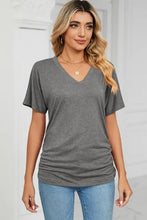 Charcoal gray ruched V-neck short sleeve T-shirt with light blue jeans