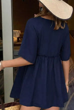Navy blue short-sleeved dress with gathered waist and flared skirt suitable for casual and formal occasions