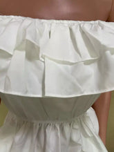 White ruffle off-shoulder high-low blouse with layered ruffles and gathered waistband in lightweight fabric