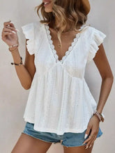 White eyelet lace ruffle sleeve v-neck blouse with cap sleeves in a lightweight fabric for elegant wear