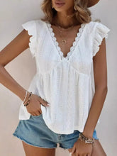 White eyelet lace ruffle sleeve v-neck blouse with cap sleeves for a stylish and feminine look
