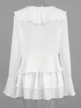 White long-sleeved ruffle trim blouse from two-piece top and skirt set