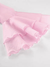 Delicate pink ruffle trimmed long sleeve blouse with soft layered pleats and flowing airy fabric texture