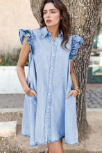 A light blue cap sleeve denim dress with ruffled shoulders and button front detailing perfect for casual wear
