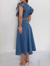 Blue denim dress with ruffled button front and shoulder details featuring a soft feel and matching belt