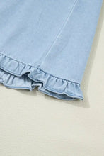 Light blue denim dress with ruffled edge collared shift design and delicate ruffled hem made for machine wash cold use