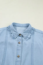 Light blue denim dress with ruffled edge collared shift design, wooden buttons, and machine wash cold care instructions
