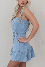 Light blue denim dress with button front detailing square neck and ruffled hem perfect for casual wear