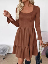 Ruffled hem long sleeve knit dress with brown ribbed fabric, square neckline and tiered skirt