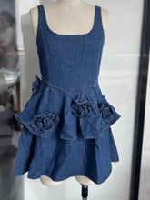 Denim dress with ruffled layered scoop neck and floral appliqués in a soft blue denim fabric