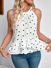 White ruffled printed halter neck cami top with black polka dots and a ruffled hem for stylish summer wear