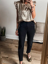 Shimmering gold metallic ruffled round neck tank with short sleeves and gathered neckline for elegant wear