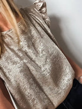 A shimmering gold metallic ruffled round neck tank with ruffled sleeves and a relaxed fit for elegant wear