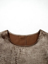 A metallic bronze textured ruffled round neck tank top with a subtle sheen and rounded neckline