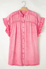 A soft pink denim mini dress with ruffled short sleeves and gathered bodice perfect as a denim mini dress