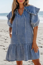 Light-wash denim mini dress with ruffled sleeves and tiered skirt featuring side pockets and puff sleeves