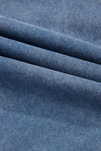 Blue denim fabric with classic twill weave texture for a ruffled side pockets puff sleeve denim mini dress