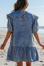 Light blue denim mini dress with ruffled collar puffed sleeves and side pockets in a casual denim mini design
