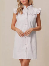 A light blue sleeveless denim dress with ruffled trim collar and shoulder accents suitable for machine wash cold