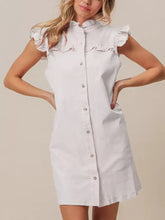 White sleeveless denim dress with ruffled trim collar and button-down front, machine wash cold care recommended