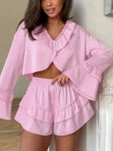 Ruffled V-neck top and shorts set in soft pink with ruffles
