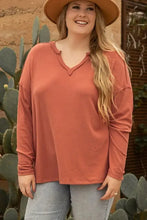 Rust notched long sleeve V-neck top for women