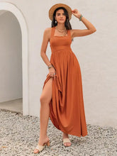 Rust smocked square neck maxi dress with terracotta high-slit, raffia hat, sandals
