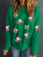 Green christmas-themed sweatshirt with embroidered santa and gifts featuring glittery accents machine wash cold